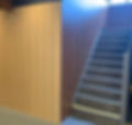 staircase with wood panel sides