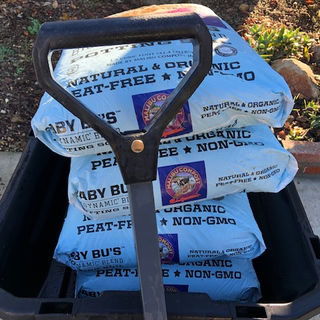 gorilla cart carrying bags of Baby Bu's Potting Soil