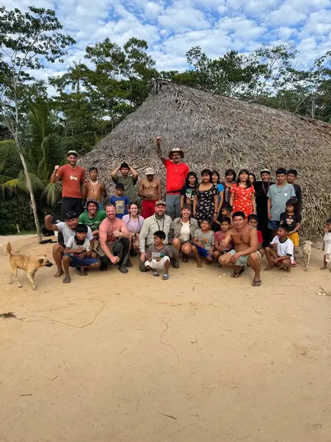 amazonian adventure where lewis and others are pictured with the matses tribe