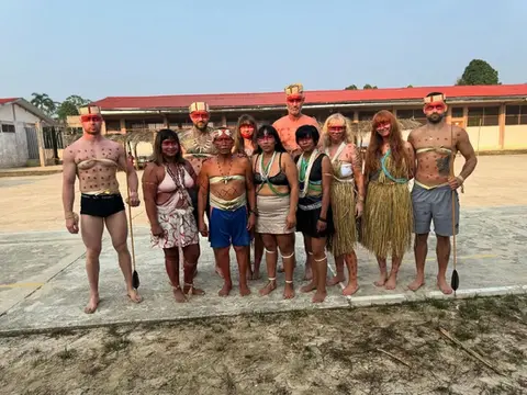 amazonian adventure where lewis and others are pictured with the matses tribe