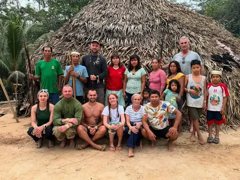 amazonian adventure where lewis and others are pictured with the matses tribe