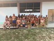 amazonian adventure where lewis and others are pictured with the matses tribe