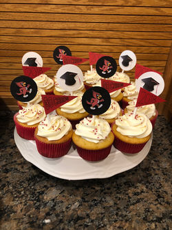 Yellow Cupcakes with Piped Vanilla Buttercream topped with Cupcake Toppers