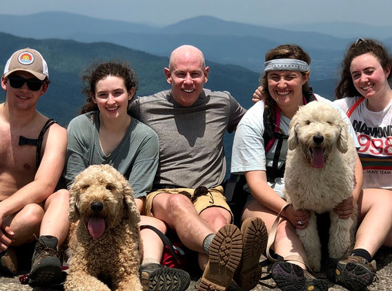 Dr. green hiking with his kids and dogs