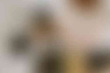 Mom filling teapot for child