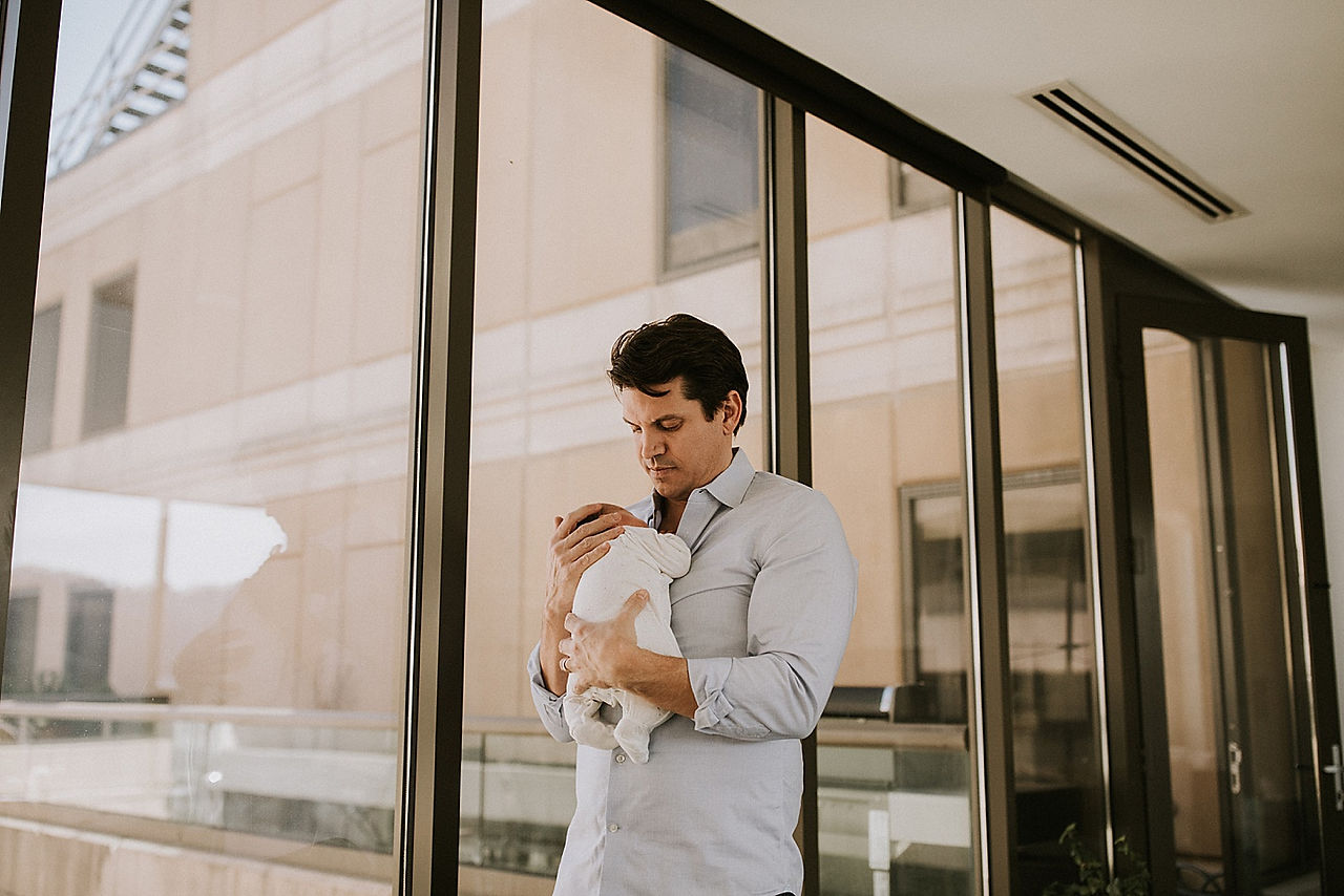 Dad holding son
