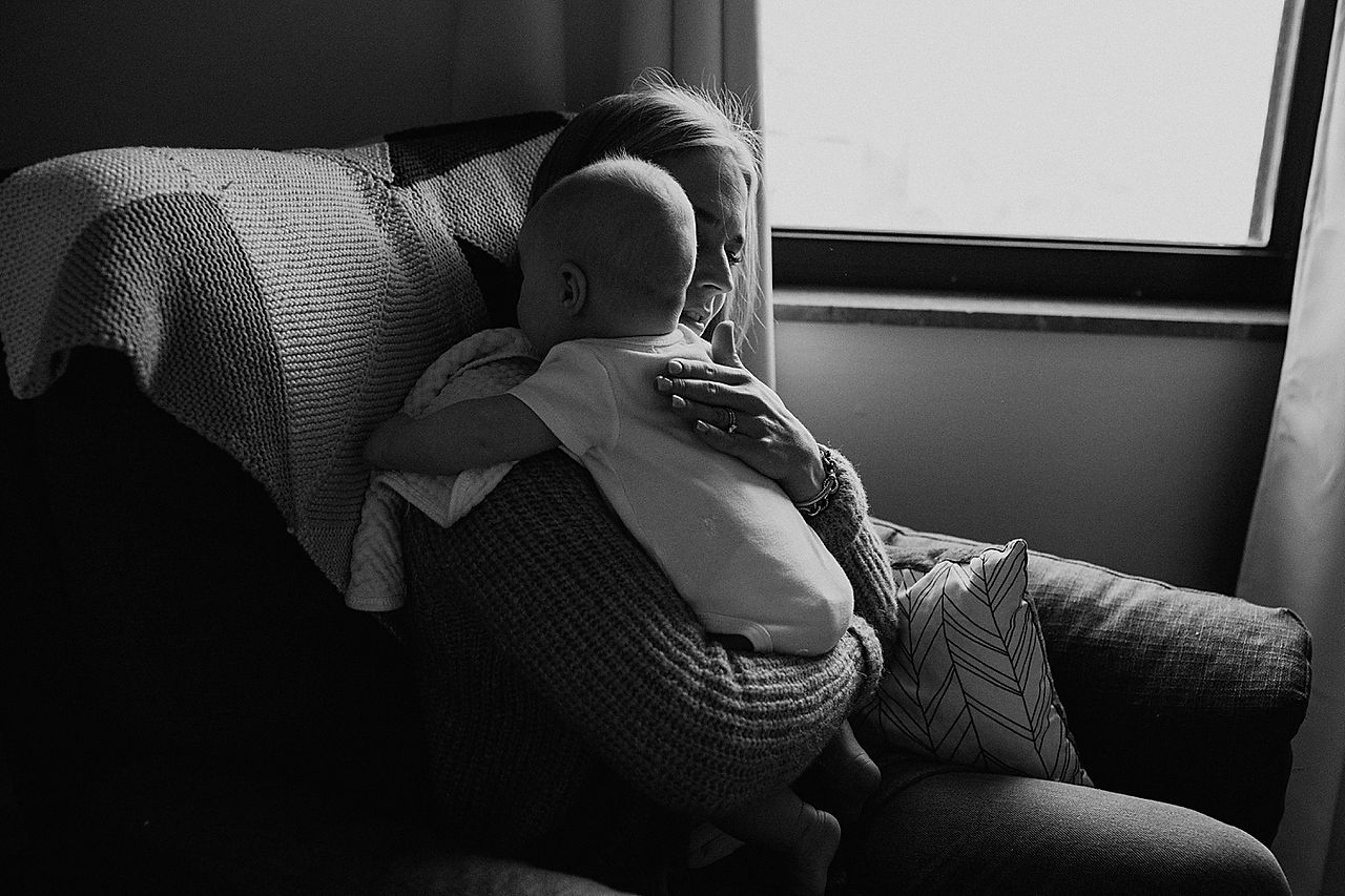 Black and white picture of mother holding baby
