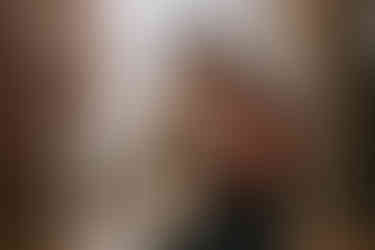 Couple portraits taken outside in the rain with clear umbrella