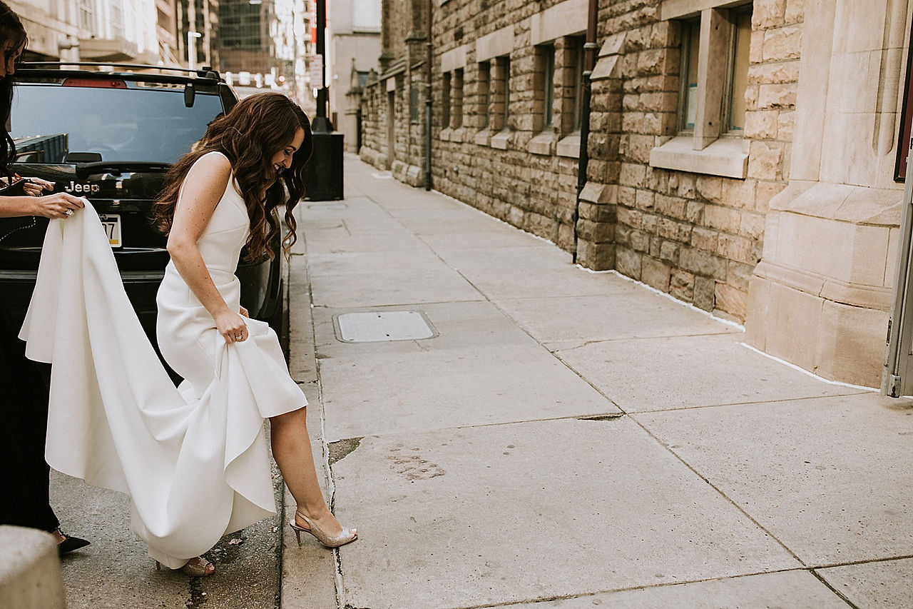 Bride stepping onto curb