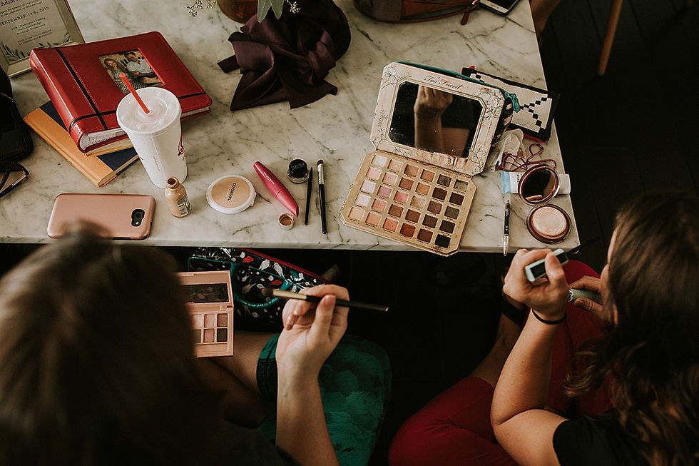 Bridesmaids doing their makeup