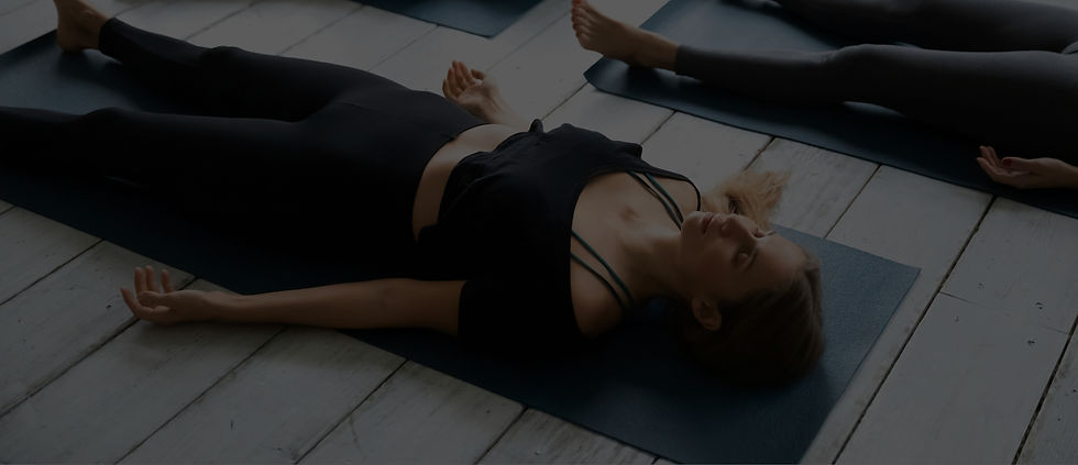 group-people-resting-after-yoga-workout-lying-shavasana-corpse-dead-body-pose-focus-caucas
