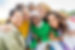 Multi ethnic group of young women hugging outside - Happy girlsfriends having fun laughing