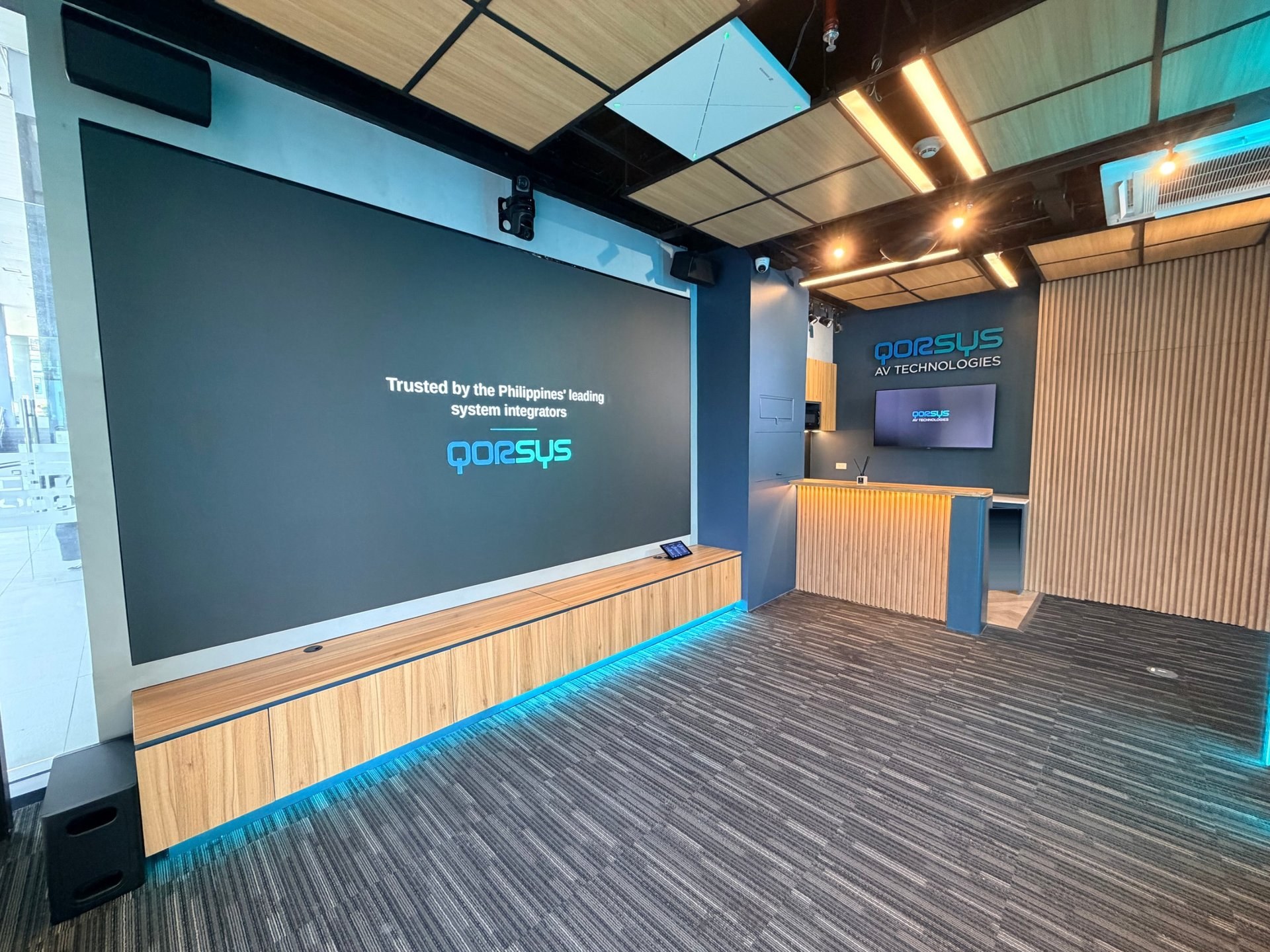 Qorsys Experience Center lobby with LED wall and reception