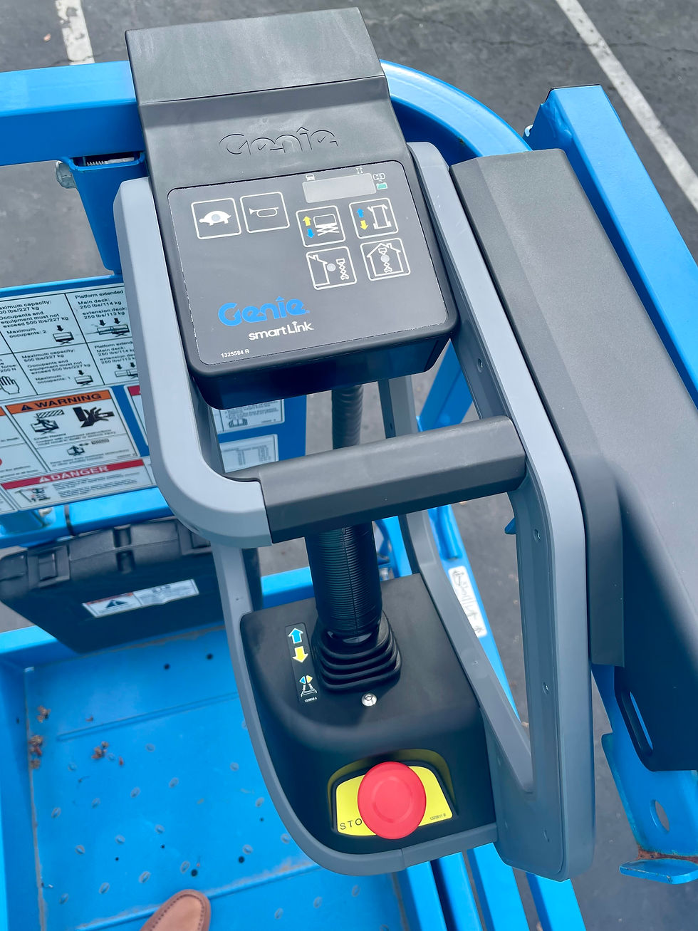 Boom lift platform control panel showing updated MEWP ergonomic joystick design for safer operator movement