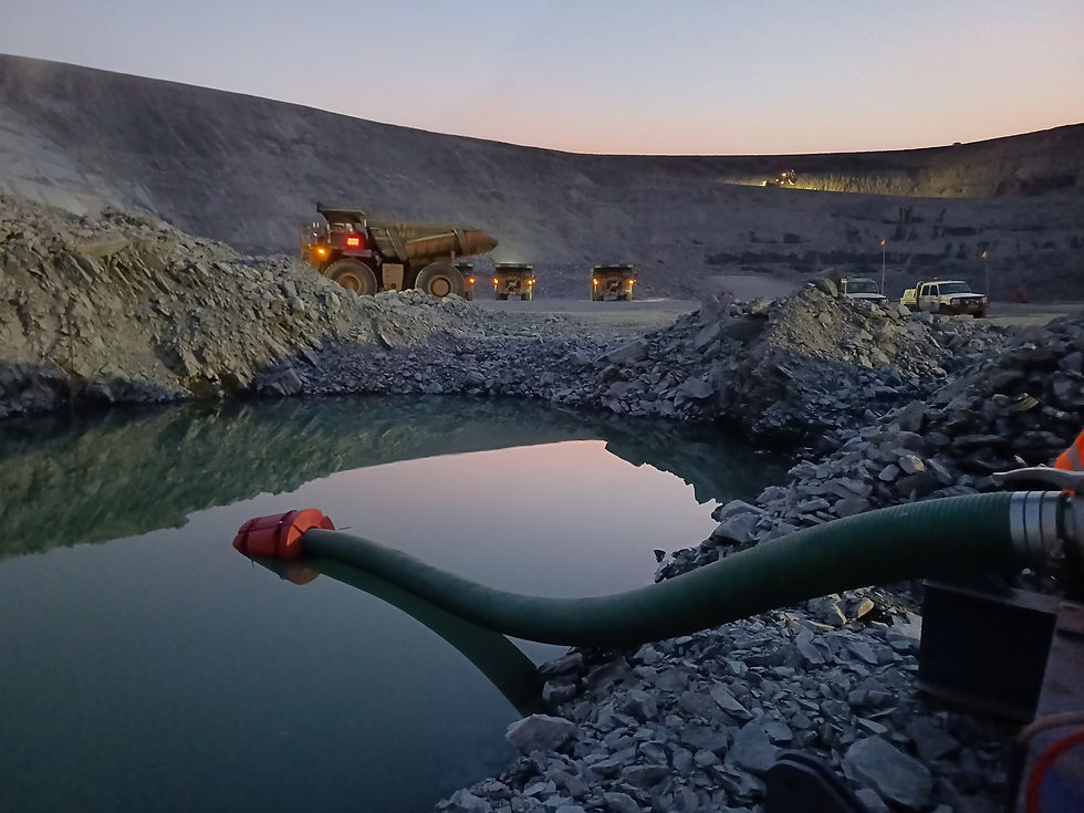 Dewatering pump system operating in an open pit mine for water management