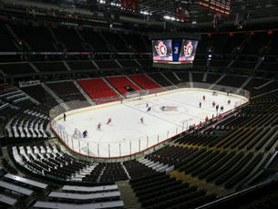 The Canadian Tire Centre arena with no fans in the seats but the team practicing on the ice.