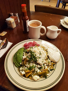 Avocado, caramelized onions, two poached eggs, queso fresco, with chilaquiles. The Nickel Diner forever the best.
