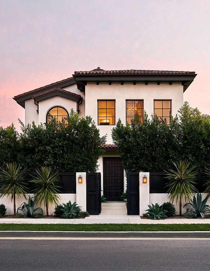 Exterior elevation of a Los Angeles home with a pink sunset sky