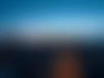 A wide aerial view of Philadelphia city skyline at dusk with soft glowing cloud infrastructure icons floating above the buildings