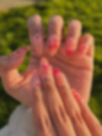 Nails with gel extensions, with pink art.