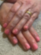 Nails with gel pink gel polish and simple flowers