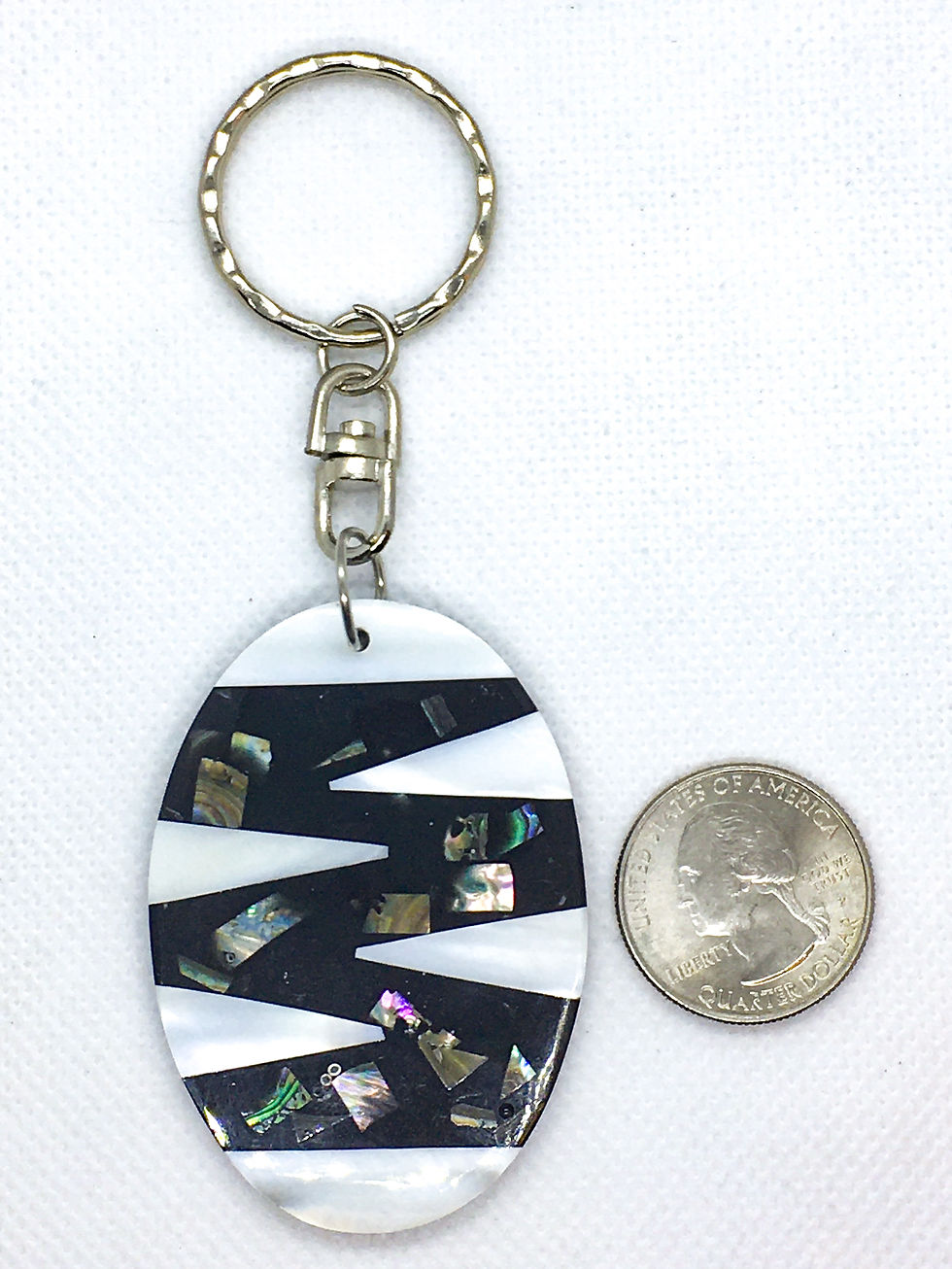 Thumbnail: White zigzag oval shell keychain