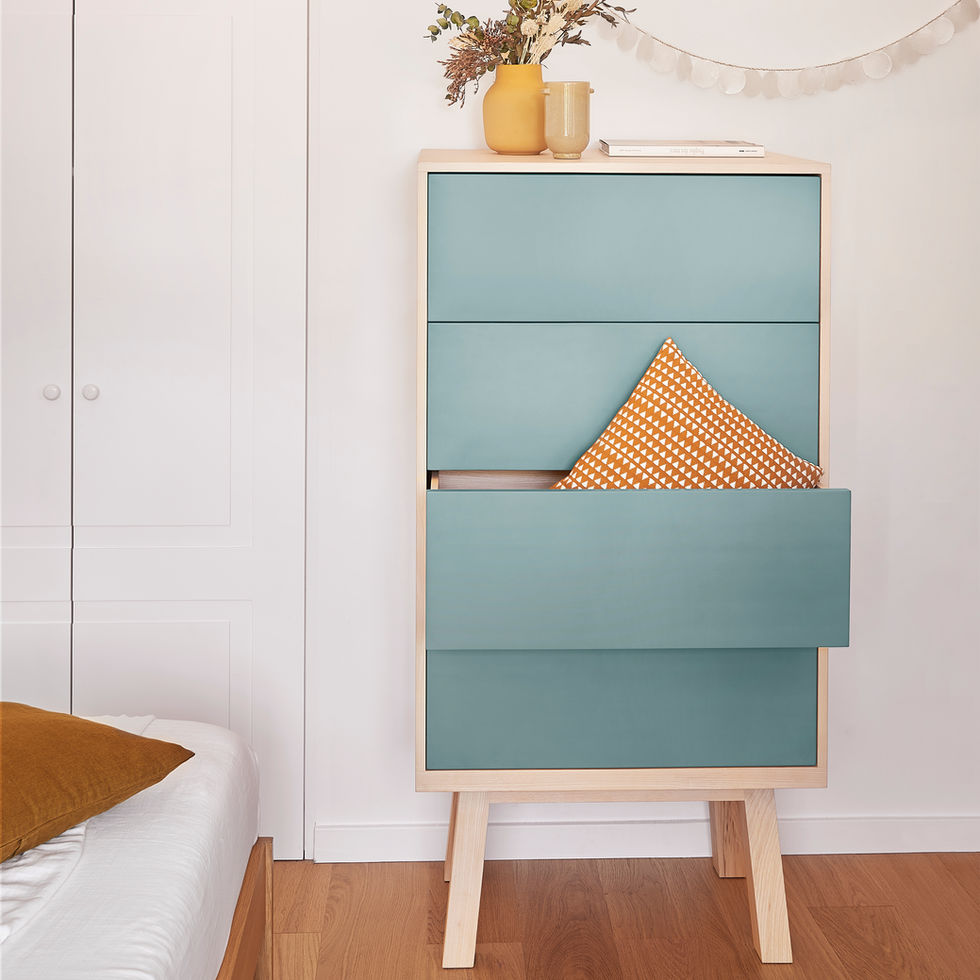 french design high narrow 4-drawer gray blue chiffonier in a bedroom close to a bed