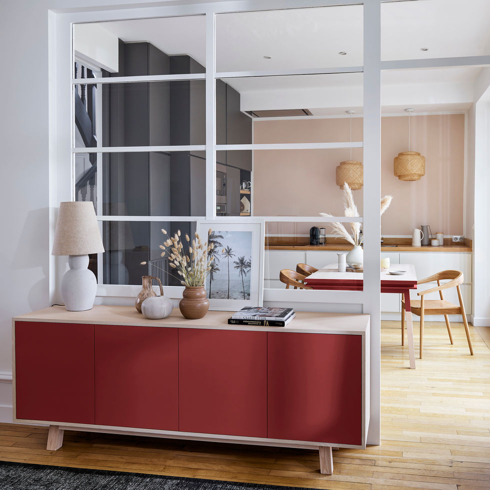 red 4-door low sideboard in wood in a room with table and glass roof