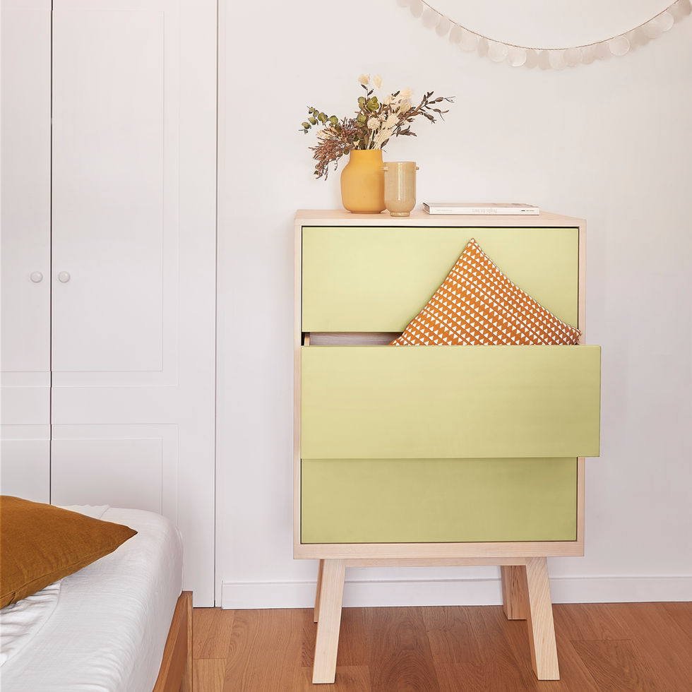 French 3-drawer yellow high handcrafted chiffonier with a cushion in a bedroom close to a bed