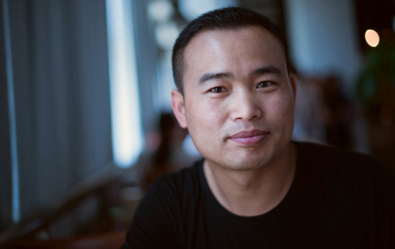Man with pensive expression looks at camera