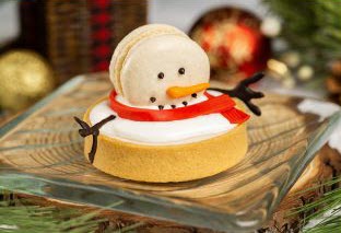 Toasted Marshmallow-Panna Cotta Tart topped with a Snowman.