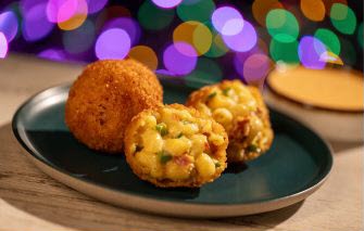 mac and cheese balls on a green plate