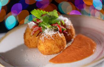 breaded italian balls with an orange vodka sauce