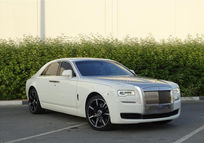 Inspecting Rolls Royce's undercarriage for damage in Dubai