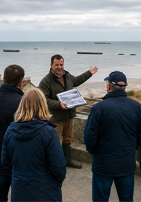 Peter Bates guid9ing at Arromanches