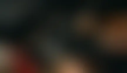 Mechanic inspecting and repairing a vehicle suspension system.