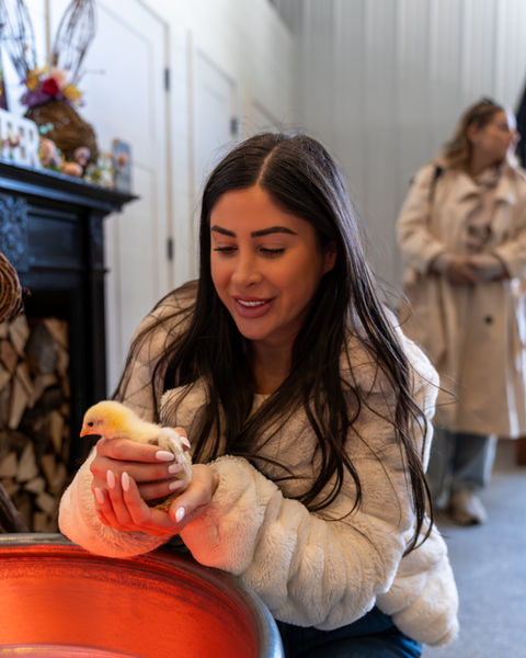Woman enjoying local products at Oak Hill Farm market GEO targeted | Oak Hill Farm, Holmdel, NJ