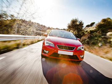 Car-On-A-Road-Full-Of-Dangerou-59426123.jpg