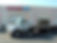 White flatbed tow truck outside Anthony's Auto Body in Shrewsbury in Shrewsbury and Toms River, NJ.