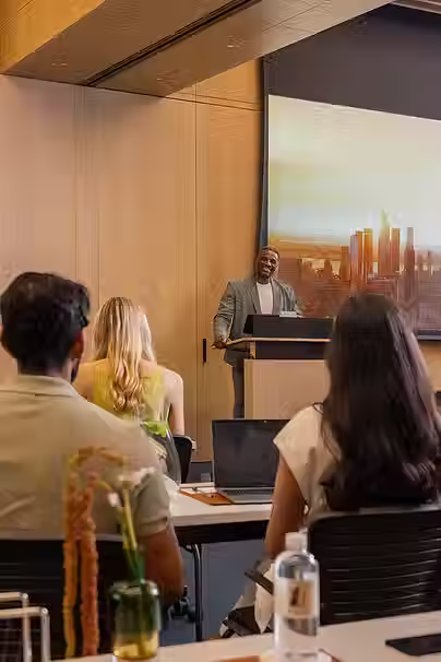 Man speaking to audience of professionals in conference center | | 2 Park Avenue
New York, NY 10016
(212) 630-3133