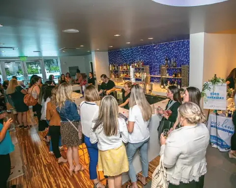 People gather at a bar during an event