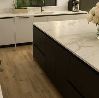 Warm neutral kitchen interior with minimalist finishes and modern lighting in Toronto luxury home.