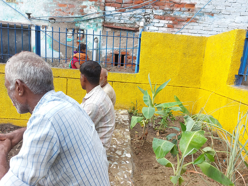 An elevated garden bed developed by raising masonry, and filling in with potting soil. Finished in a clean broken tile mosaid, the garden bed doubles up as attractive public seating.