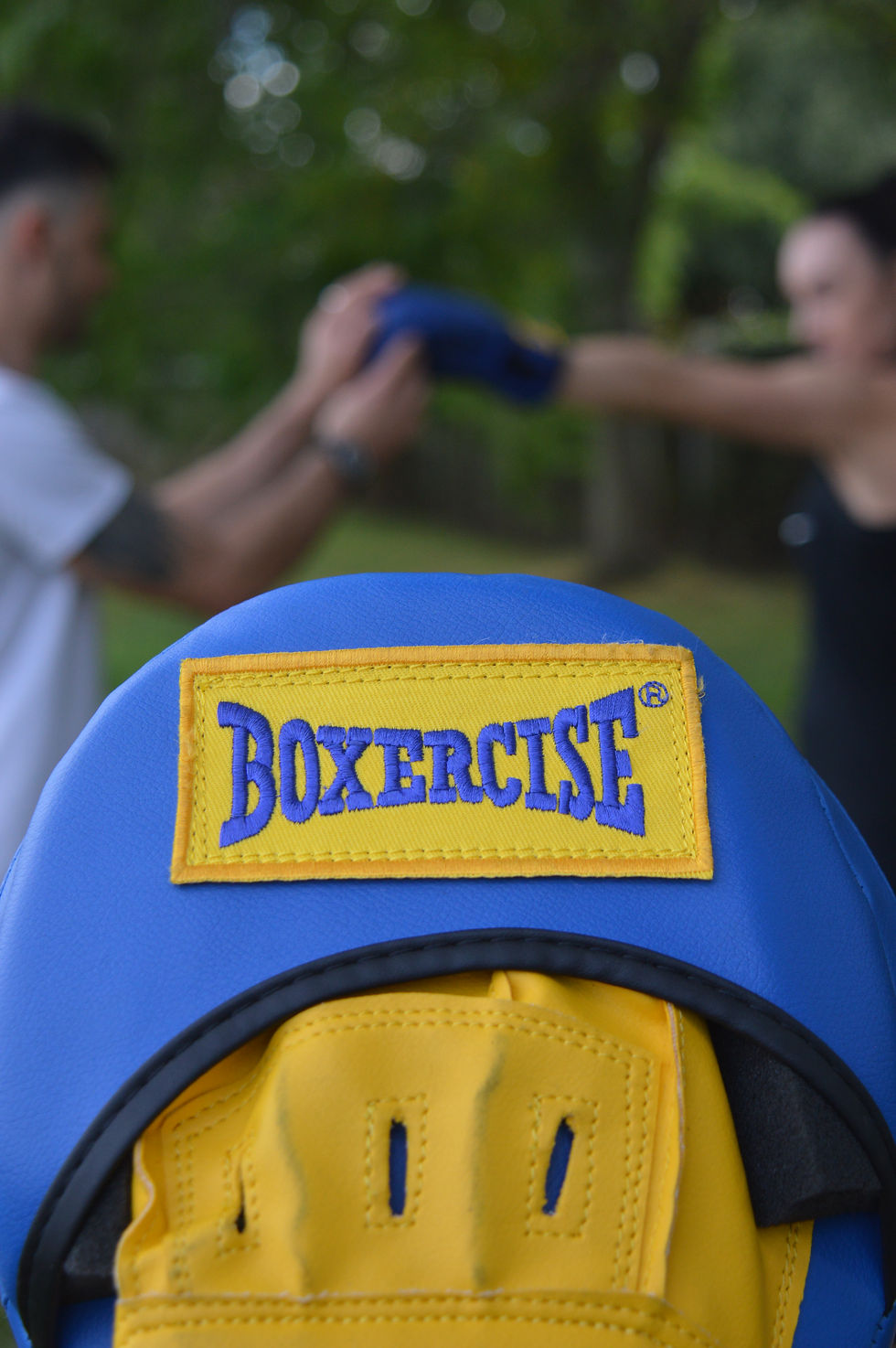 Eye-level view of a fitness instructor leading a Boxercise class