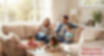 Family relaxes on a living room sofa while children play a board game, enjoying a bright, comfortable home interior.