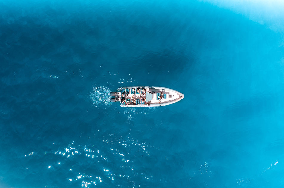 Aerial view of Local guides at a Hanalei Charters boat tour on the Na Pali Coast