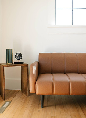 Couch and end table with decor in venue
