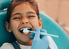 Cute girl getting dental exam istock_0.jpg