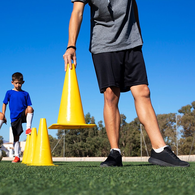 front-view-man-training-kids_23-2149742080.jpg