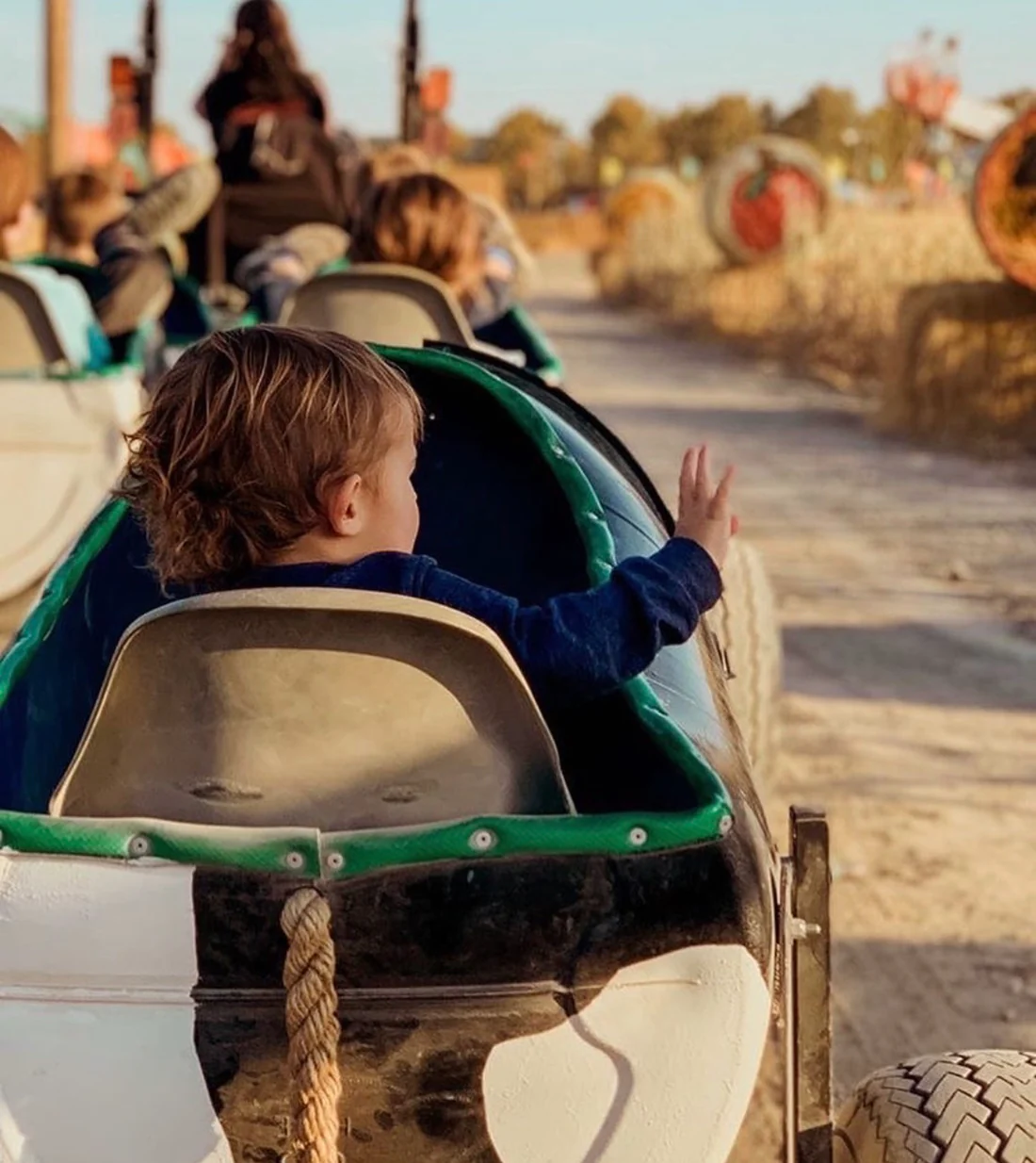 CowTrain_Kid_WavingGoodbye_1100x.webp